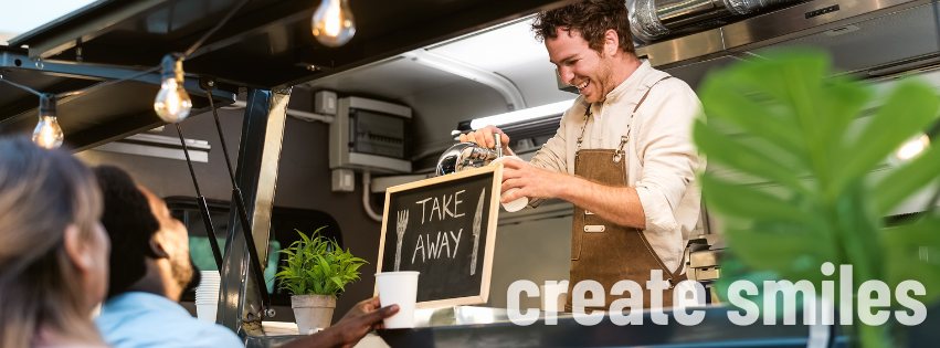Image of a takeout restaurant chef smiling as he serves a loyal customer. The text 'create smiles' is shown in the bottom right. 