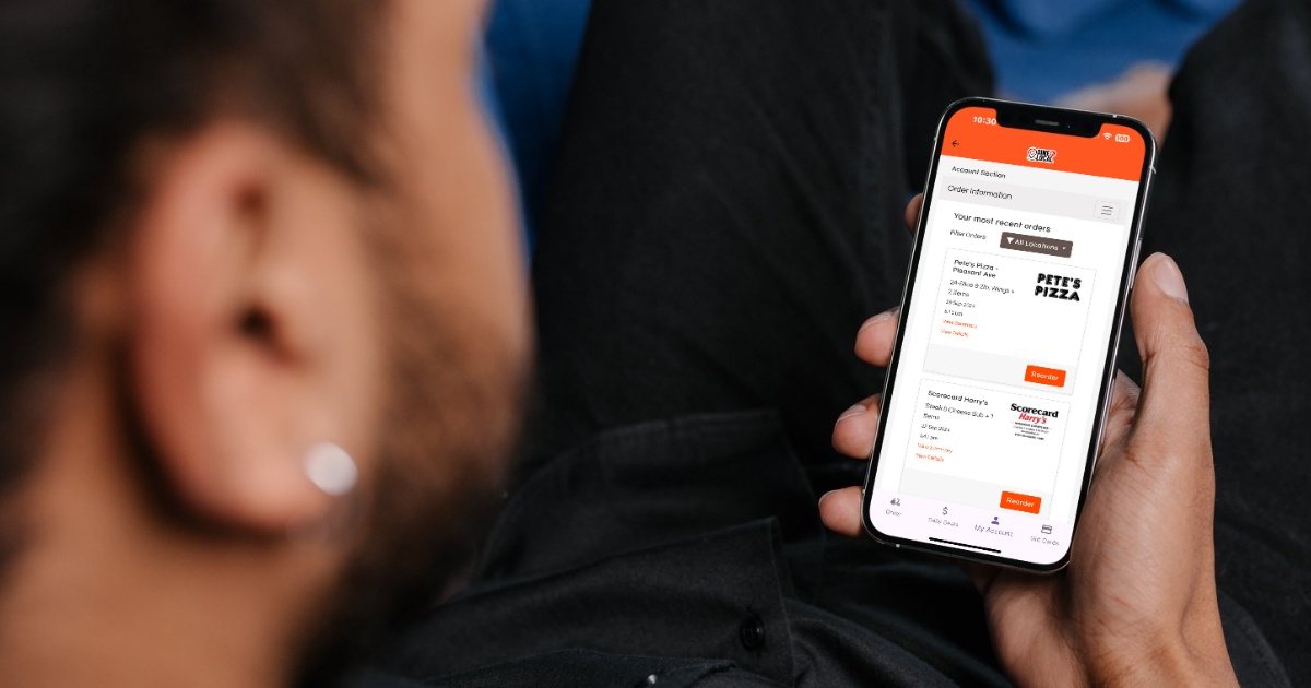Digital restaurant customer looking at his previous orders on Dine Local with the words Digital Customers Drive Profit superimposed.
