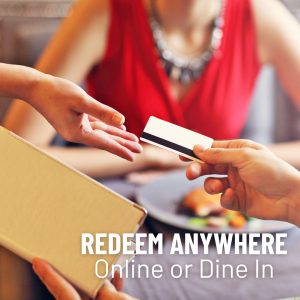 Image of a person paying at a restaurant with a gift card with the words redeem anywhere, online or dine in