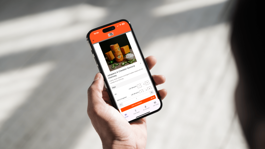 A photo of a user browsing a unique menu item using the Dine Local App for ordering of takeout and delivery from a local independent restaurant.